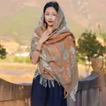 Ethnic style orange paisley shawl scarf with white tassels worn by a model in outdoor - 65*200cm / Vintage Paisley Style 8