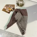 Pleated brown cotton linen square scarf with mint green stripes in a chic lifestyle setting - 90cm / OM Stripe Coffee