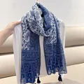 Detailed view of elegant blue and white floral print scarf featuring decorative corner tassels - Blue and White Porcelain / 180cm