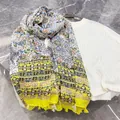Close-up detail of a vintage floral print chiffon shawl with elegant tassel fringe edges - Beige Flower / 180cm