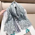 Detailed macro view of mint green floral cotton linen scarf with turquoise tassels - Light Green Floral / 180cm