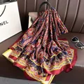 Detailed macro view of a red silk-like shawl with intricate ethnic patterns and satin finish - Navy Blue Elegant Red Silk