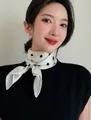 Close-up detail of an elegant white silk scarf with black polka dots on a neck - 70cm / Beige Polka Dot