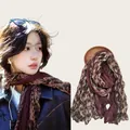 Detail view of a vintage floral print scarf on a model and displayed separately - 180cm / Maroon Floral