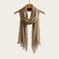 Elegant brown pleated long scarf for women with vintage aesthetic hanging on wooden hanger - 180cm / Dark Camel