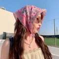 Model wearing a pink floral cotton linen headscarf in an outdoor sunny setting - 58x58cm / Pink Small Floral