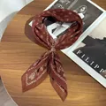 Close-up of a brown pleated vintage paisley silk scarf with a gold buckle detail - Pleated Square Scarf (With Scarf Ring) / 70cm / Coffee Brown Paisley