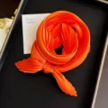 Vibrant orange pleated square scarf for women, elegant silk-like neckerchief - Orange / 45-90cm