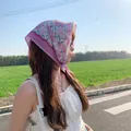Floral cotton linen square scarf worn as a bohemian headscarf in natural sunlight - Pink Big Flower