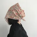 Elegant 58cm floral cotton linen headscarf featuring a delicate orange flower print. - Yellow Floral