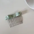 Detailed shot of a Korean style floral fabric hair comb for fringe and side styling - Green Floral Bow Style (FJ83135)