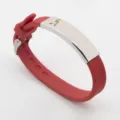 Red silicone autism awareness bracelet featuring stainless steel puzzle ribbon plate - Red