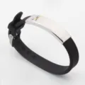 Black autism awareness silicone bracelet featuring a curved silver stainless steel plate - Black