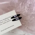 Detailed close-up of black duckbill hair clips with purple bow and sparkling rhinestone - Bowknot Rhinestone Duckbill Clip / 2 Pcs/Set / Black