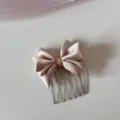Detailed view of champagne satin bow on a silver metal hair insert comb - Brown Bowknot Hair Comb