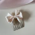 Close-up of a elegant cream satin bow hair comb for bangs styling and hair organizing - Beige Bowknot-Comb