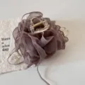 Macro view of a dusty purple ruffled mesh hair claw clip for elegant and stylish hairstyles - Coffee Cloud Mesh Flower Style / Coffee Cloud Mesh Flower Claw Clip