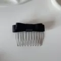 Elegant black satin ribbon bow hair comb accessory featuring ten silver metal teeth - Bow Hair Comb / Black