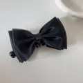 Detailed macro view of a black mesh bow hair clip with a sweet and elegant design. - Mesh Bow - Banana Clip / Black