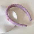 Close-up view of purple plaid fabric headband with a pink heart charm detail - Cherry Letter Headband / Purple Plaid