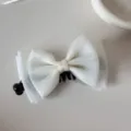 Top view of a sweet white mesh bow hair clip with black comb base - Mesh Bow - Banana Clip / Beige