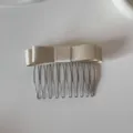 Detailed view of the champagne satin bow on a 10-tooth metal hair comb - Bow Hair Comb / Champagne
