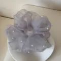 Detail view of grey mesh scrunchie with delicate faux pearl accents and ruffled edges. - Scrunchie / Gray