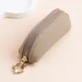 Petit porte-monnaie en cuir de vachette véritable avec fermeture éclair dorée taupe - Gris