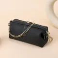 Black pebbled leather crossbody bag with detachable gold chain strap for women - Black