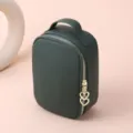 Dark green lychee grain cowhide leather cosmetic bag with golden double heart zipper pull. - Dark Green