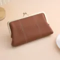 Elegant brown pebbled leather kiss-lock clutch purse with luxury gold metal frame - Brown