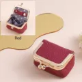 Mini red genuine leather jewelry pouch with gold kiss-lock frame and polka-dot lining - Burgundy