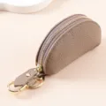 Étui à clés compact en cuir véritable grainé taupe avec une fermeture éclair dorée - Gris