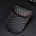 RFID signal blocking car key pouch with carbon fiber texture and red stitching detail - Vertical