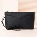 Elegant black lychee grain cowhide leather wristlet clutch with gold zipper hardware detail. - Black