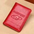 Red RFID leather travel passport holder cover with embossed globe and plane design - 64-Grained Split Leather / Leather Passport Cover / Red