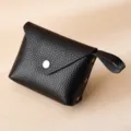 Premium black genuine leather coin purse with textured finish and secure snap button - Black