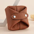 Small brown genuine leather coin purse with pebbled texture and metal snaps - Brown