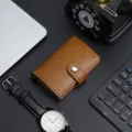 Elegant brown PU leather automatic popup card holder with aluminum case and snap button closure - Brown
