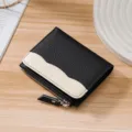 Compact pebbled leather wallet for women with black and white color block design. - Black