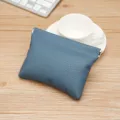 Blue lychee pattern mini coin purse with metal spring closure for small essentials - Denim Blue