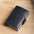 Navy blue faux leather double-layer aluminum pop-up cardholder on light wooden surface - Dark Blue