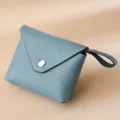 Compact light blue pebble leather coin purse with wrist strap and snap closure - Light Blue