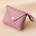 Handmade mini pink pebbled leather coin purse featuring a silver snap button and wrist strap - Light Pink