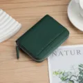 Compact RFID blocking green pebbled leather card holder with secure zip-around closure. - Dark Green