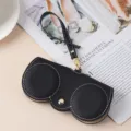Portable black genuine leather sunglasses pouch with wrist strap and gold button - Black