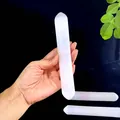 Hand holding a natural Morocco selenite crystal stick showing its fibrous texture - Single Selenite Rod / Selenite Rod approx. 20x2-2.5CM