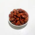 Polished natural red jasper tumbled stones in white bowl for DIY decor and aquarium - Red Jasper / 100g Pack