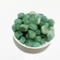 Natural polished green aventurine crystal stones presented in a white ceramic bowl - Aventurine Jade / 100g Pack