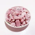 Premium polished natural pink crystal gravel stones displayed in a white ceramic bowl - Pink Opal / 100g Pack